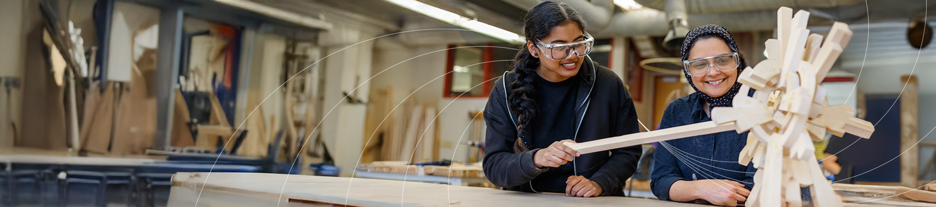 Faculty and staff hugging each other and taking a photo